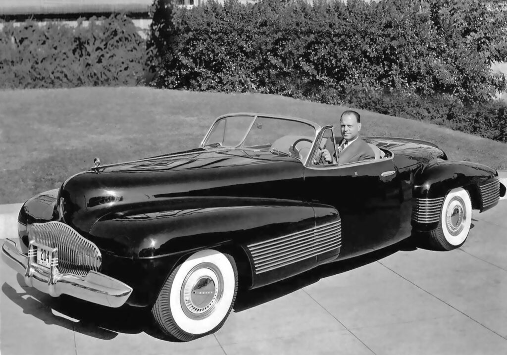 Harley Earl with the 1938 Buick Y-Job, the first "concept car" in history.