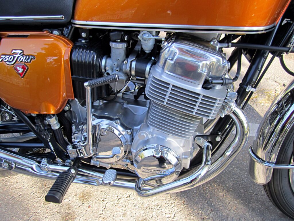 The CB750 Four's four-cylinder engine with its separate oil tank (dry-sump lubrication).